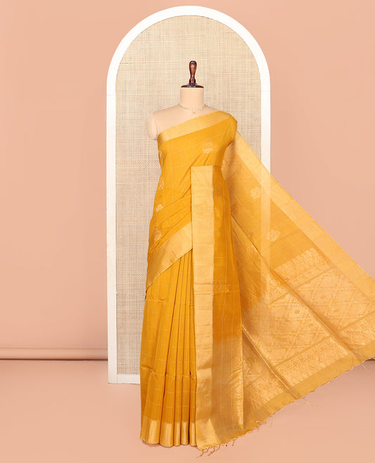 Yellow Silk Cotton Saree, Subtly Sparkled With Butta Enclosed Checks On Its, Subtle Bavanji Border, Grand Jaal Pallu and Paired with a Matching Blouse