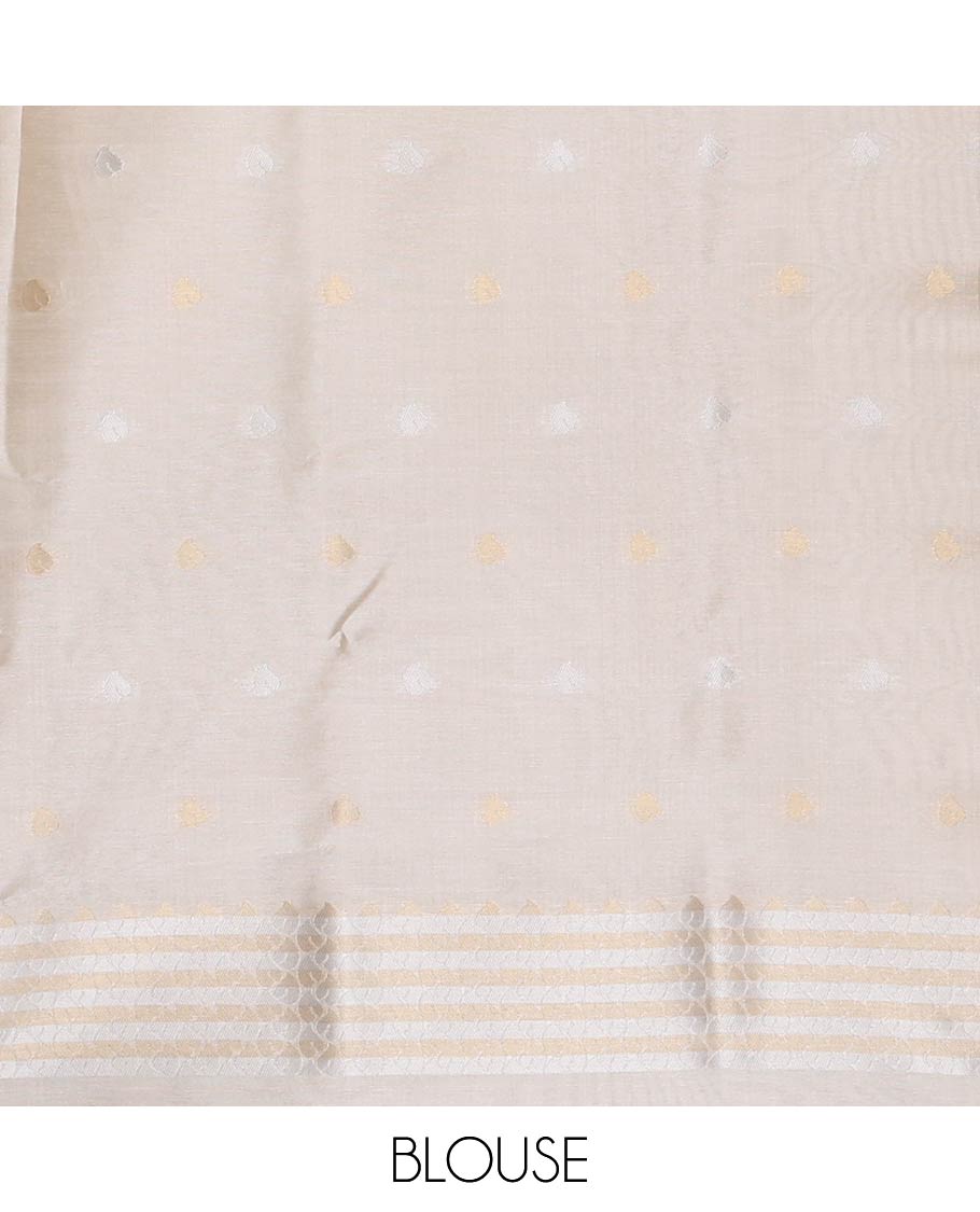 Cream Semi Tussar Saree Adorned with Zari Circle Buttas, Gleaming Border Steeped with Zari Leaf Designs, Pallu Richly Woven with Leaf Designs in Zari, and Paired with a Matching Blouse