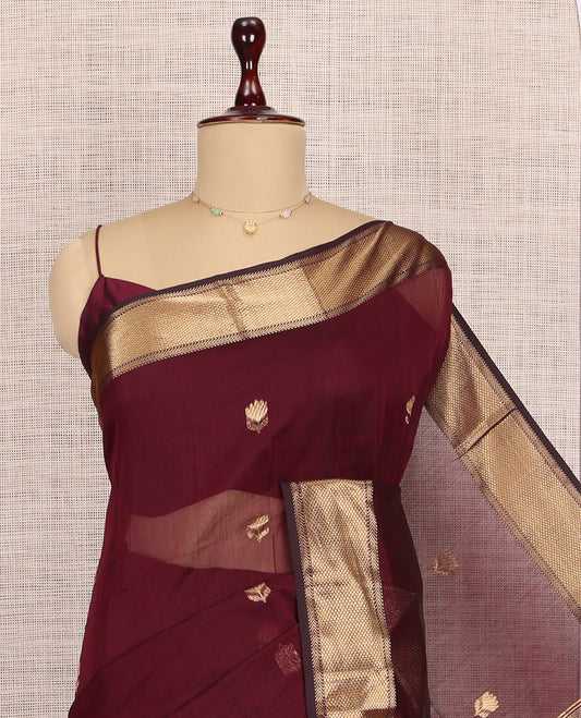 Maroon Maheshwari Cotton Saree, Elevated with Buttas, Highlighted by a Traditional Zari Border, Zari Gleamed Up Pallu, and a Matching Blouse