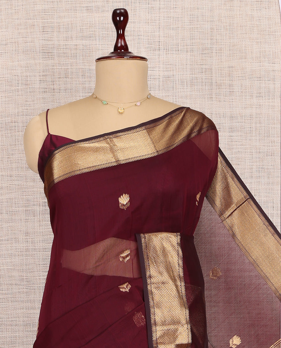 Maroon Maheshwari Cotton Saree, Elevated with Buttas, Highlighted by a Traditional Zari Border, Zari Gleamed Up Pallu, and a Matching Blouse