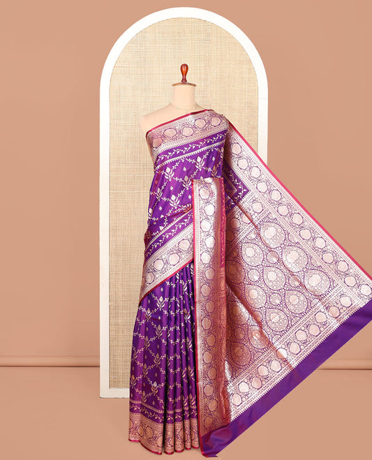 Violet Semi-Banaras Saree, Gracefully Embellished with Jaal Jacquard on Its Body, Highlighted by Floral Creeper Design Border, Intricately Designed Pallu, and Paired with a Matching Blouse