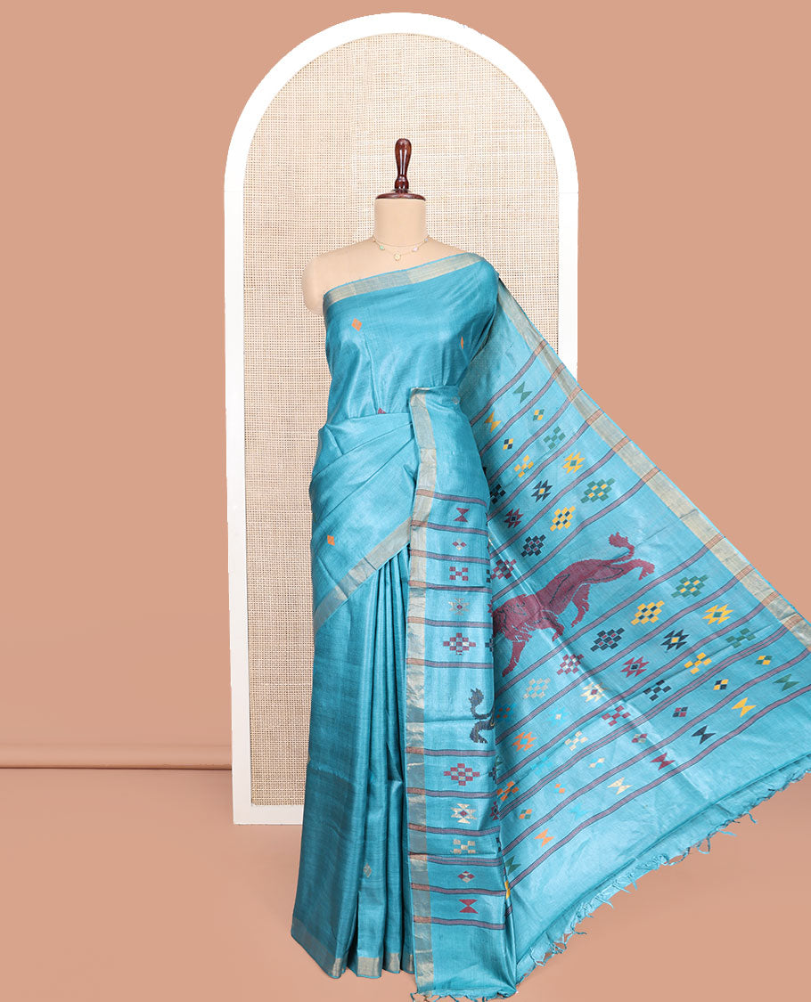 Blue Tussar Silk Saree, Subtly Woven with Multi-Color Diamond Buttas All Over Its Body, Subtle Bavanji Border, Pallu Depicts Animal and Geometric Designs, and Paired with a Matching Blouse