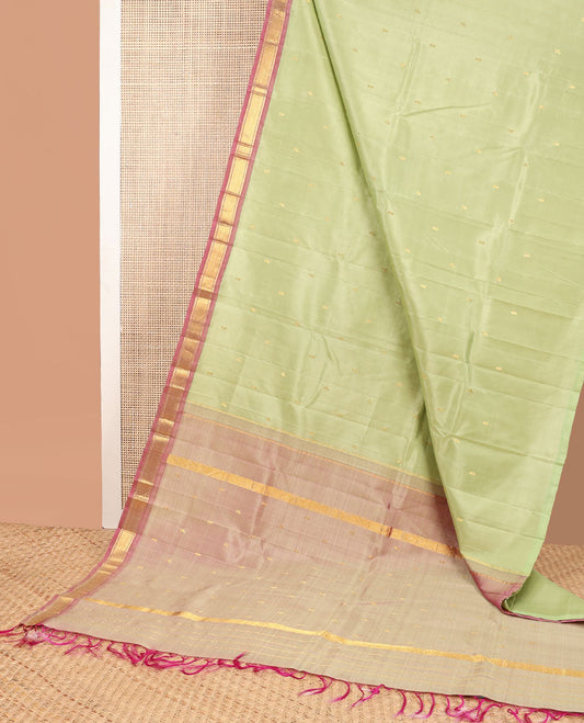 Mint green buttas kancheepuram silk saree with contrast border of banaras, kuyil kann design & zari design pallu