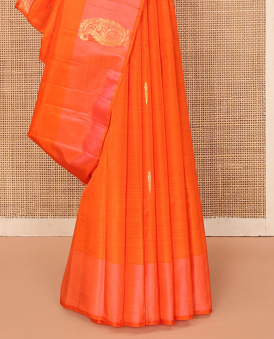 Orange Kanchipuram Silk Saree, Subtly Sparkled with Zari Buttas on Its Body, Complemented by a Contrast Border of Manga Designs, Pallu Steeped with Floral Designs, and Paired with a Contrast Blouse