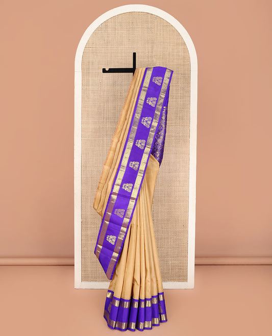 Sandal Kanchipuram Silk Saree, Highlighted with Zari Buttas on Its Body, Complemented by a Contrast One-Sided Korvai Border of Diamond and Mayil Designs, Pallu Features Floral and Paisley Designs, and Comes Without a Blouse