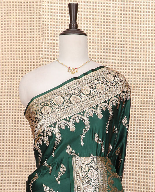 Green floral buttas banarasi silk saree, traditional zari border of floral creeper designs, and pallu of intricate designs