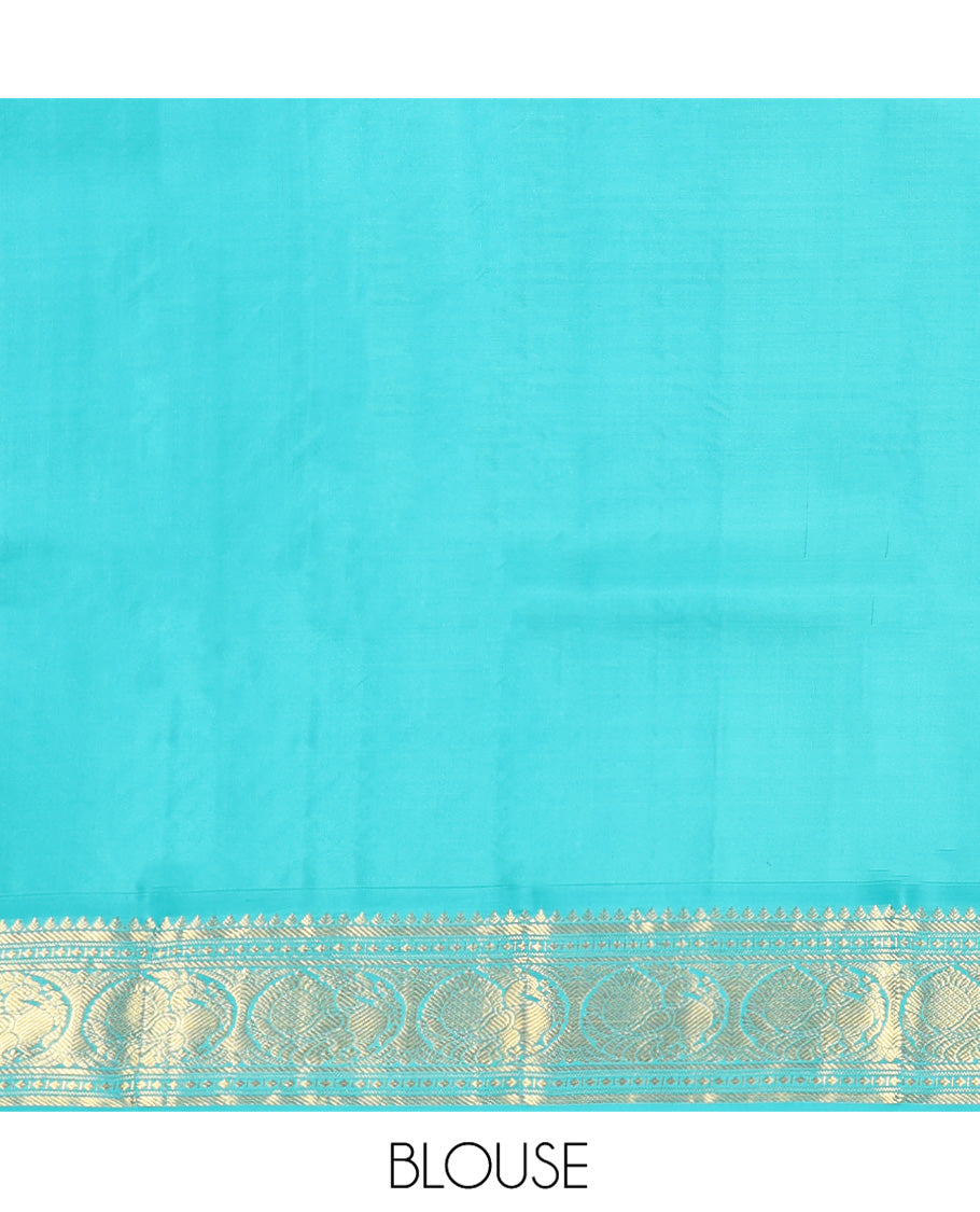 Red Vasundhara Silk Saree, Sparsely Woven with Zari Buttas All Over Its Body, Complemented by a Contrast Border of Rekku, Banaras, Diamond, and Round Mayil Designs, Grand Jaal-Patterned Pallu, and Paired with a Contrast Blouse