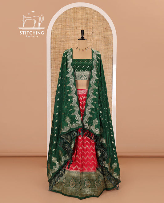 Tomato red chiniya crepe half-saree, chevron zari jacquard with contrast intricate patterned stone work bordered skirt, contrast blouse, and a scallop bordered intricate dhavani