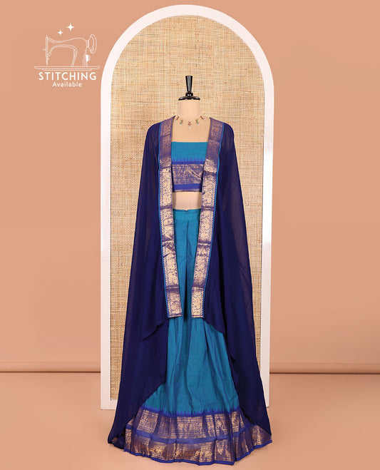 Blue Chettinad Cotton Half-Saree Featuring a Plain Skirt, Highlighted with a Contrast Peacock-Elephant Motifs Woven Rettai Pettu Zari Border, a Subtly Woven Matching Blouse, and a Vichitra Silk Contrast Traditional Zari-Bordered Dhavani