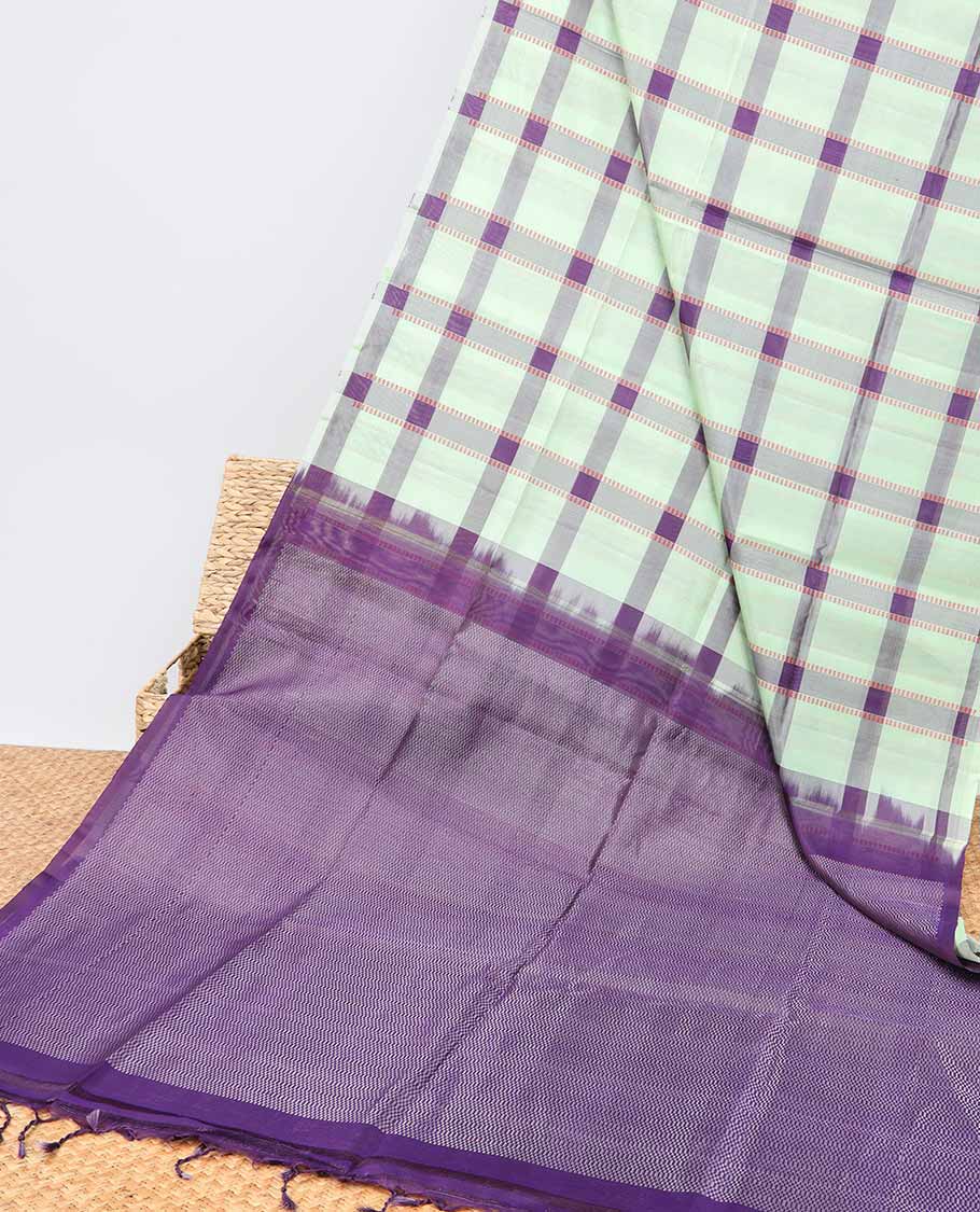 Borderless green checked soft silk saree with intricate zari design pallu