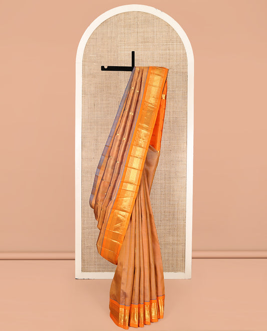Orange Kanchipuram Silk Saree, Decorated with Zari Buttas, Complemented by a Contrast One-Sided Border of Panner Sombu, Banaras, Muthu, and Jaal Designs, Grand Pallu, and No Blouse