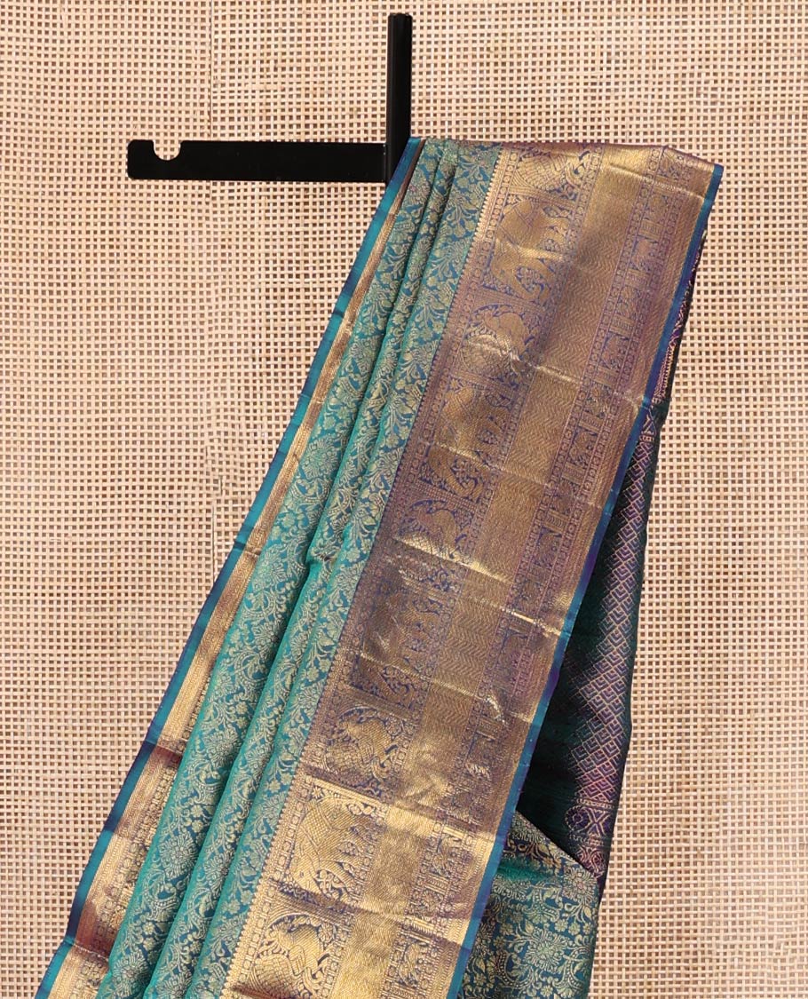 Blue Kanchipuram Wedding Silk Saree, Spotlighted with Jacquard Design Weave, Highlighted by Zari Border of Thilakam Mokku, Muthu, Banaras, Rudraksham, Mayil, Yaanai, and Vanki Designs, Grand Jaal Pallu, and Paired with a Matching Blouse