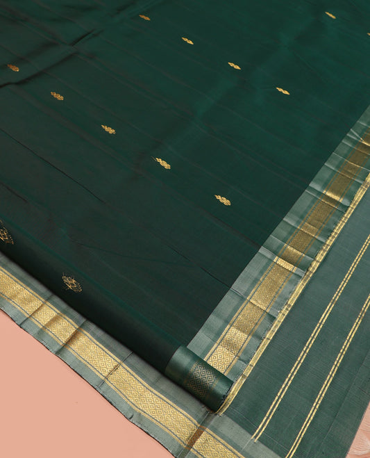 Green Kanchipuram Silk Saree, Embellished with Zari Buttas, a Contrast One-Sided Border of Mayil Kann Designs, a Zari-Design Pallu, and No Blouse