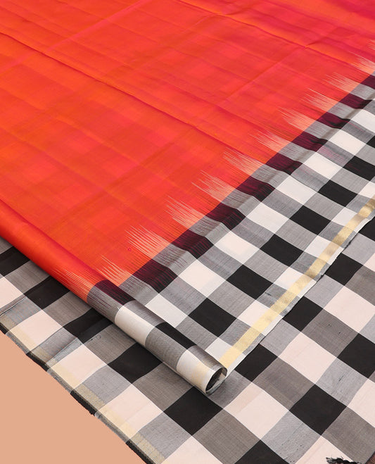 Orange Plain Mayuri Soft Silk Saree, Complemented by a Contrast Black-White Chess-Style Checked Border, Chess-Style Checked Pallu, and Paired with a Contrast Blouse
