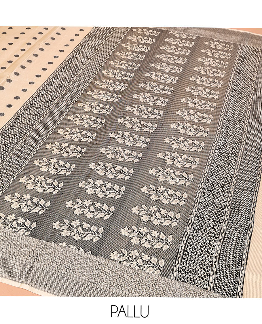 Cream Mayuri Soft Silk Saree, Accentuated with Polka Dot Buttas All Over Its Body, Sparsely Woven Geometric Patterned Border, Pallu Steeped with Floral Designs, and Paired with a Matching Blouse
