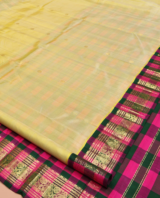 Yellow Kanchipuram Silk Saree, Subtly Sparkled with Zari Buttas, a Contrast One-Sided Korvai Checked Border of Neli, Banaras, and Jada Nagam Designs, Zari Design Pallu, and No Blouse