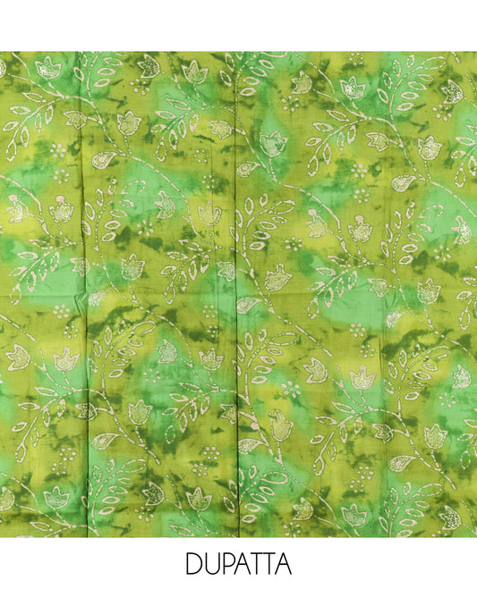 Cream-Green Kerala Cream Mul Chanderi Material Churidar Features Pom-Pom Neckline Top, a Contrast Batik Floral Printed Bottom, and  Dupatta