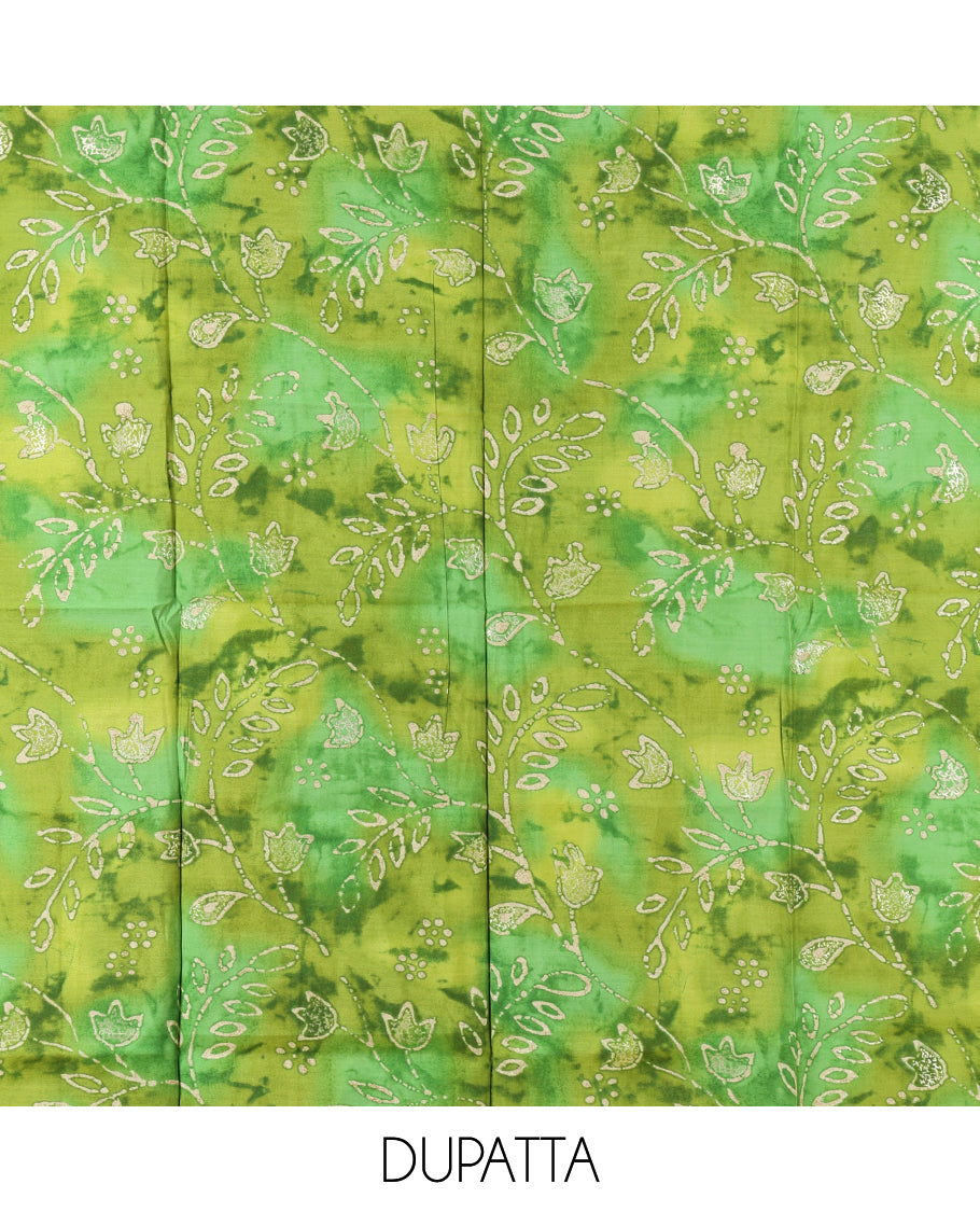 Cream-Green Kerala Cream Mul Chanderi Material Churidar Features Pom-Pom Neckline Top, a Contrast Batik Floral Printed Bottom, and  Dupatta