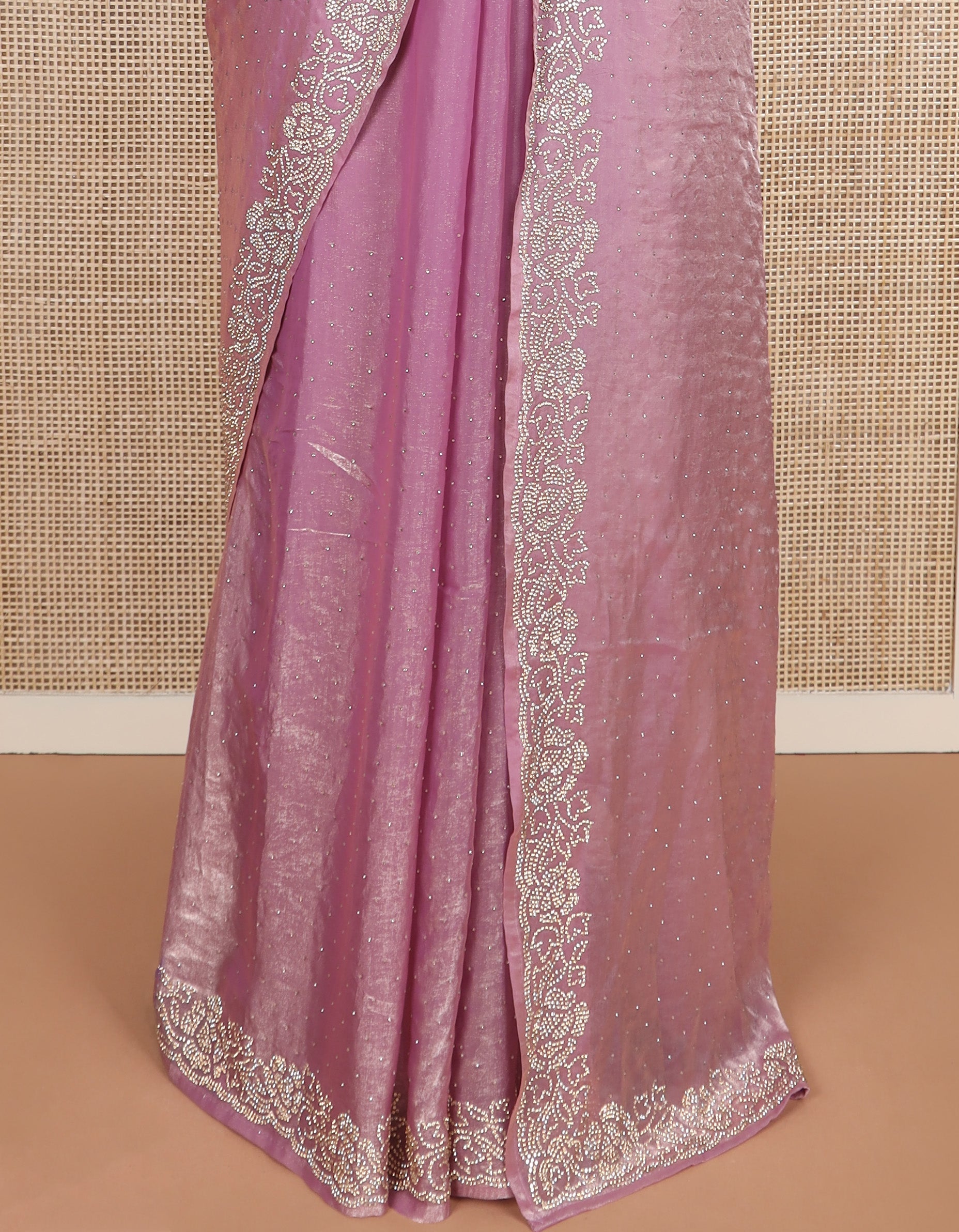 Pink stone work designer saree, micro-stone work border, and a contrast half-sleeve blouse of floral vine design in micro stones
