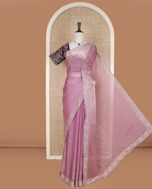 Pink stone work designer saree, micro-stone work border, and a contrast half-sleeve blouse of floral vine design in micro stones