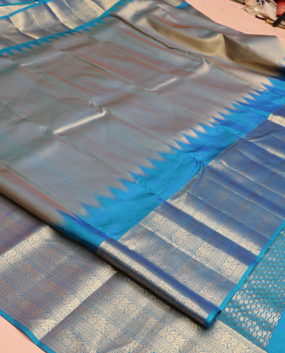 Scintillating Blue Vasundhara Lite-Silk Mix Saree, Gleamed Up with Zari on Its Body, Highlighted by Thazampoo Rekku Border of Neli, Paisa, Cross Kamalam, and Kodi Visiry Designs, a Grand Geometric-Patterned Pallu, and Paired with a Matching Blouse