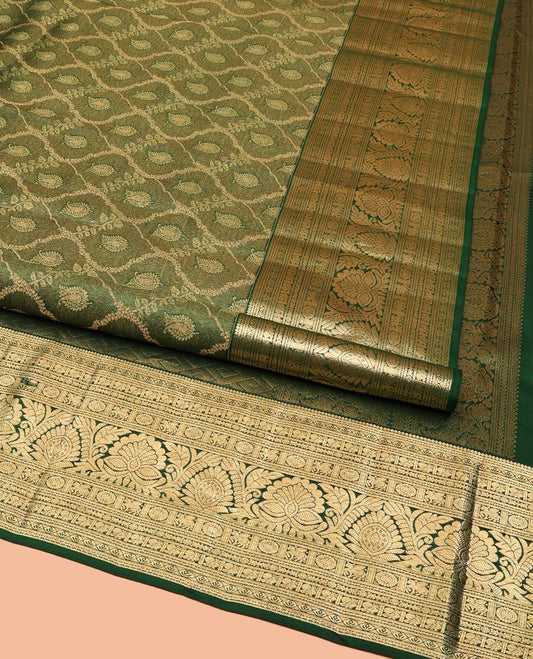 Green Kanchipuram Wedding Silk Saree, Elevated with Jacquard Designs on Its Body, Highlighted by a Traditional Zari Border of Kuthirai, Chakram, and Mayil Designs, Pallu of Greek Key Designs, and Paired with a Matching Blouse