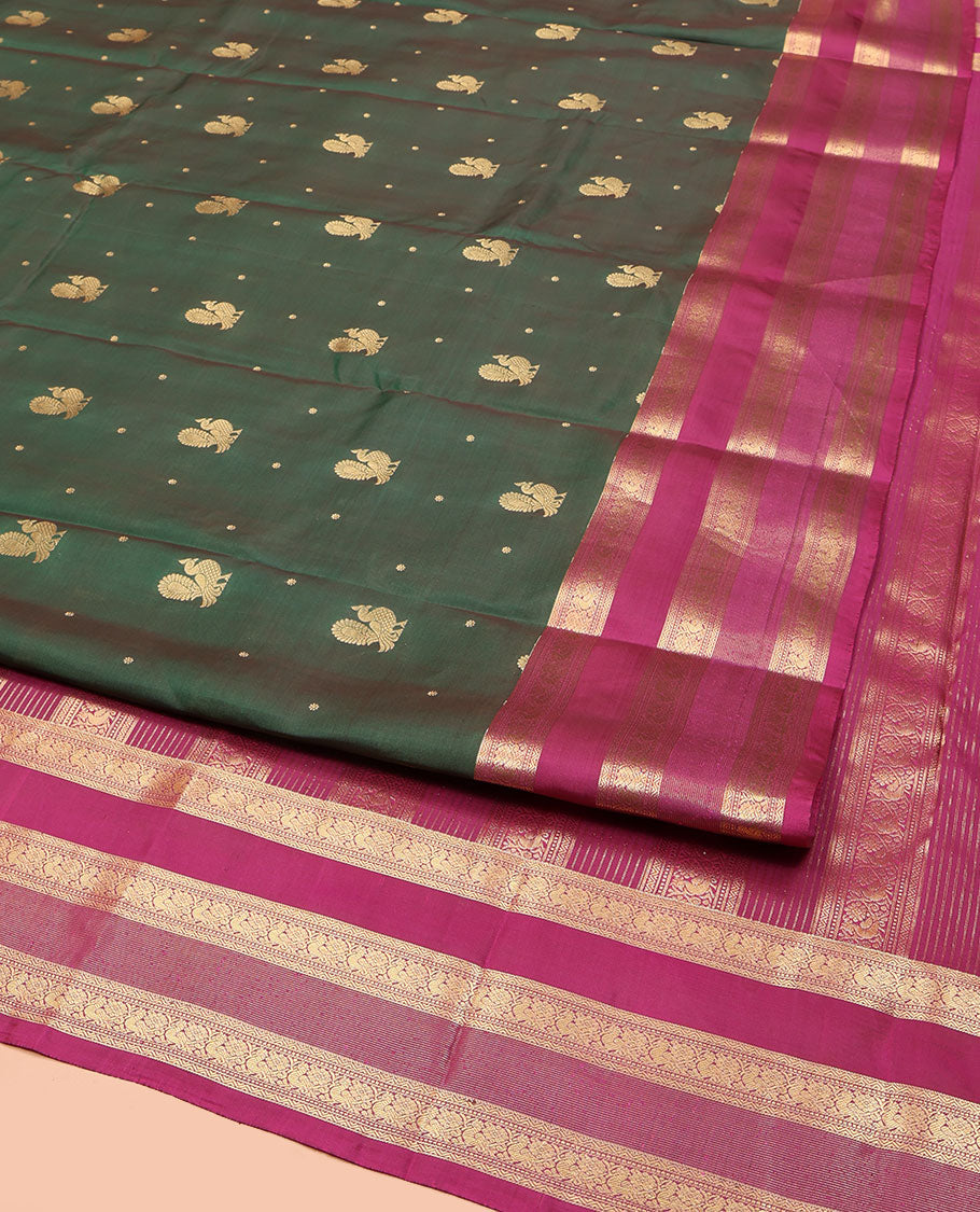 Green Vasundhara Lite Silk Mix Saree, Graced with Mayil Buttas All Over Its Body, Complemented by a Contrast Border of  Neli, Muthu, and Chakram Designs, Pallu Steeped with Traditional Designs, and Paired with a Contrast Blouse