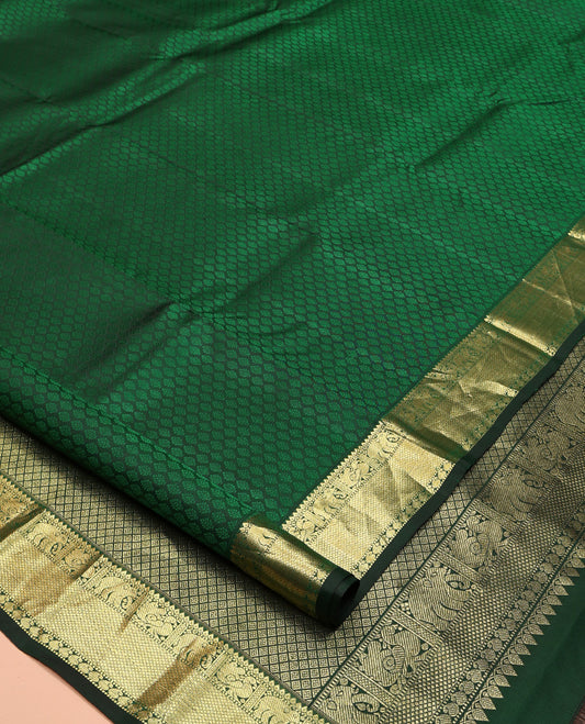 Green Embossed Parampara Silk Saree, Elevated with Zari Border of Thilakam, Mayil, Yaanai, Mayil Kann, and Manga Designs, Grand Jaal Pallu and Paired with a Matching Blouse