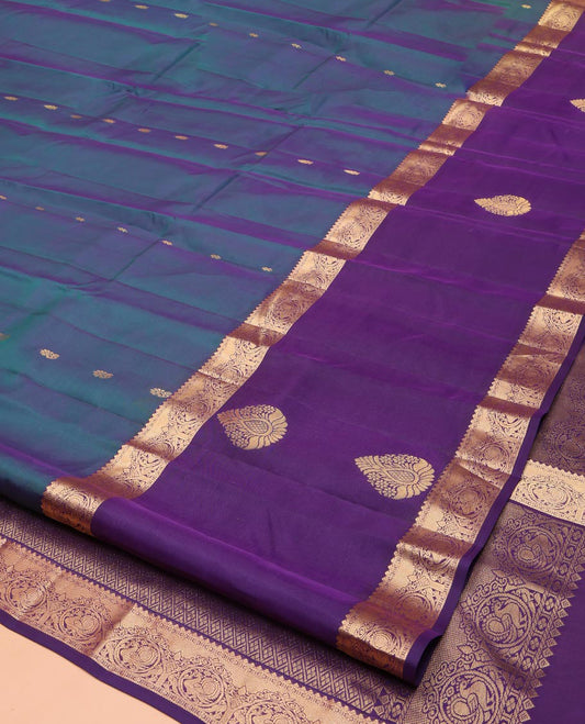 Blue Vasundhara Lite Silk Mix Saree, Ornamented with Zari Buttas on Its Body, Complemented by a Contrast Border of Thilakam, Kamalam, and Mayil Designs, Grand Jaal Pallu, and Paired with a Contrast Blouse