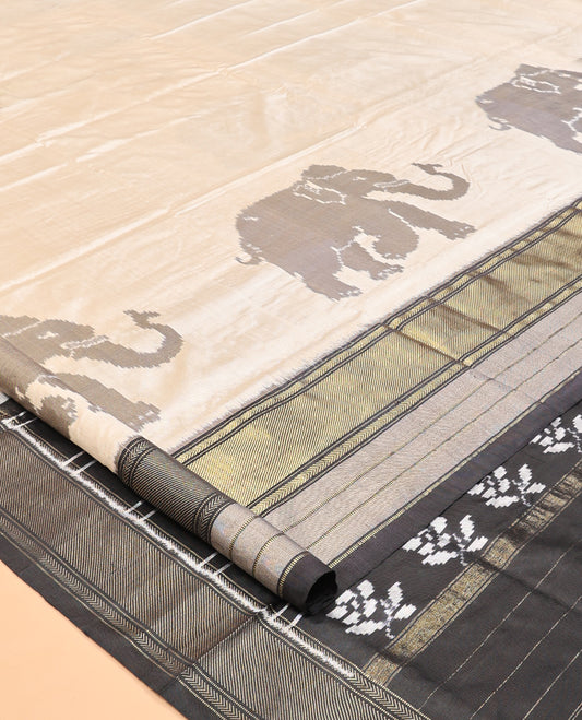 Cream Pochampally Ikat Saree, Adorned with Elephant Motifs, Complemented by a Contrast Traditional Zari Border, Ikat Pallu, and a Contrast Blouse