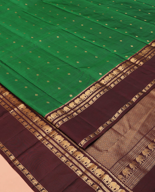 Green Vasundhara Silk Saree, Elevated with Zari Buttas All Over Its Body, Complemented by a Contrast Rettai Pettu Border of Yaanai Designs, Grand Jaal Pallu, and Paired with a Contrast Blouse