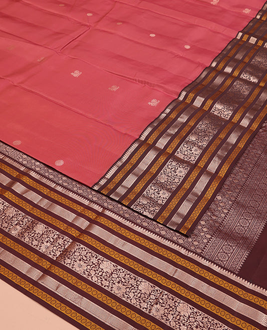 Pink Vasundhara Silk Saree, Embellished with Mayil and Chakram Buttas All Over Its Body, Complemented by a Contrast Border of Thilakam, Neli, Laddu Kamalam, and Kodi Visiry Designs, Grand Pallu of Butta Enclosed Checks, and Paired with a Contrast Blouse