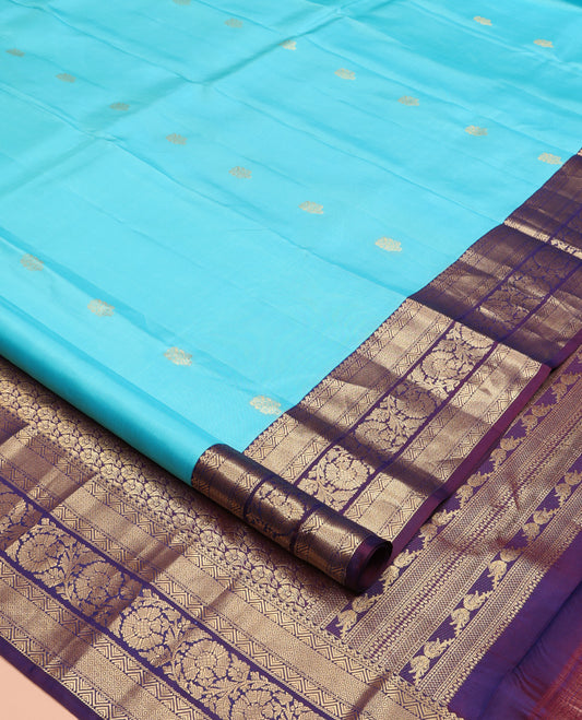 Blue Vasundhara Silk Saree, Adorned with Zari Buttas All Over Its Body, Complemented by Contrast Border of Mayil Kann And Kodi Visiry Designs, Grand Pallu and Paired with a Contrast Blouse