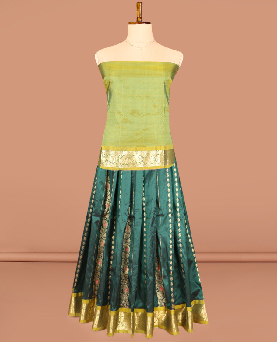 Green Pure Silk Half-Saree, Accentuated with Zari Buttas on Its Body, Complemented by a Contrast Floral and Paisley Design Border, Complemented by a Contrast Blouse, and Paired with a Contrast Dhavani of Jaal Designs