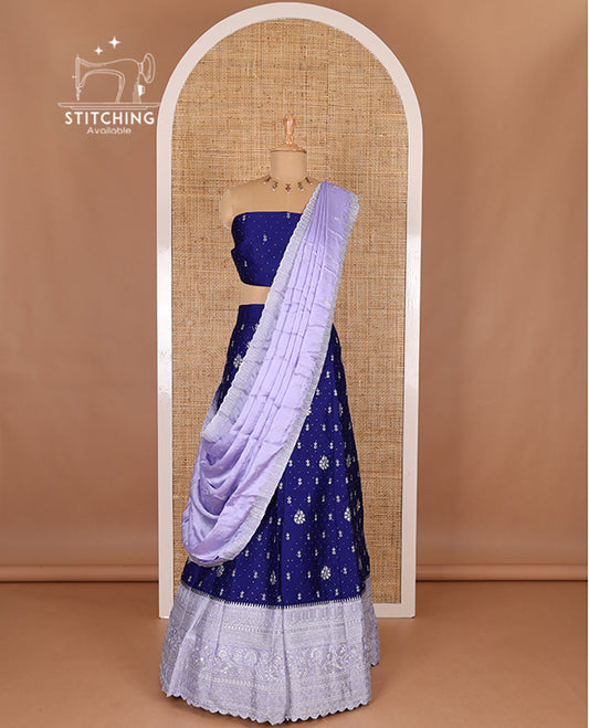 Blue half-saree, floral motifs embroidered semi raw silk top, matching embroidered blouse, and contrast scallop embroidered georgette dhavani