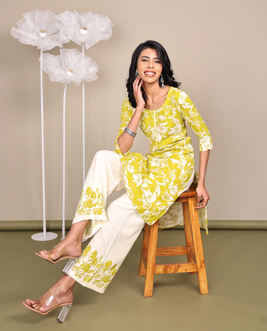 Green Cotton Ready-Made Suit, Featuring Silhouette-Style Floral Prints, a Round Neckline, 3/4 Sleeves, and Straight-Cut Top, Paired with Floral-Printed Straight-Cut Pants