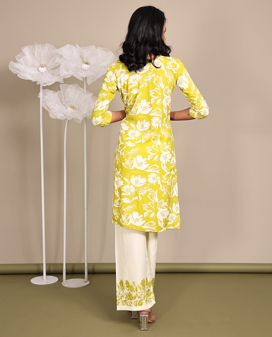 Green Cotton Ready-Made Suit, Featuring Silhouette-Style Floral Prints, a Round Neckline, 3/4 Sleeves, and Straight-Cut Top, Paired with Floral-Printed Straight-Cut Pants