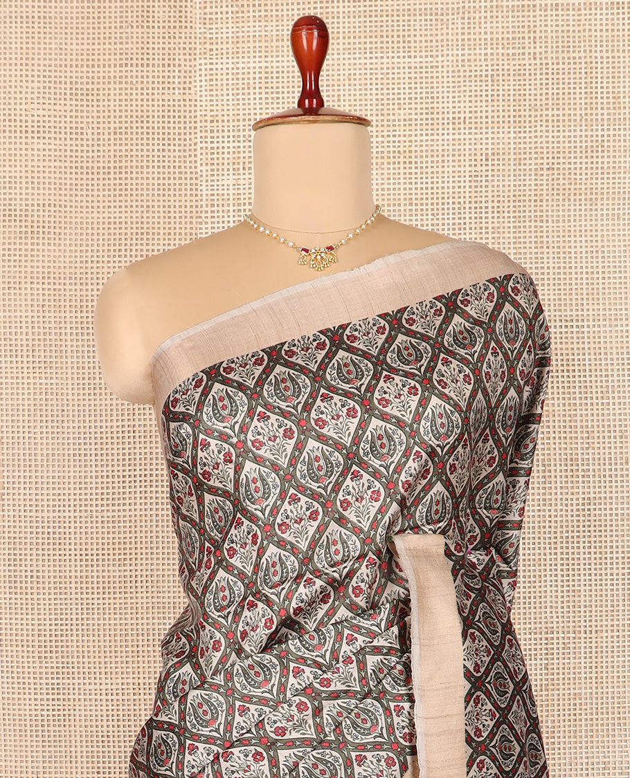 Green ogee patterned tussar silk saree, contrast bavanji border, and double-color plain pallu