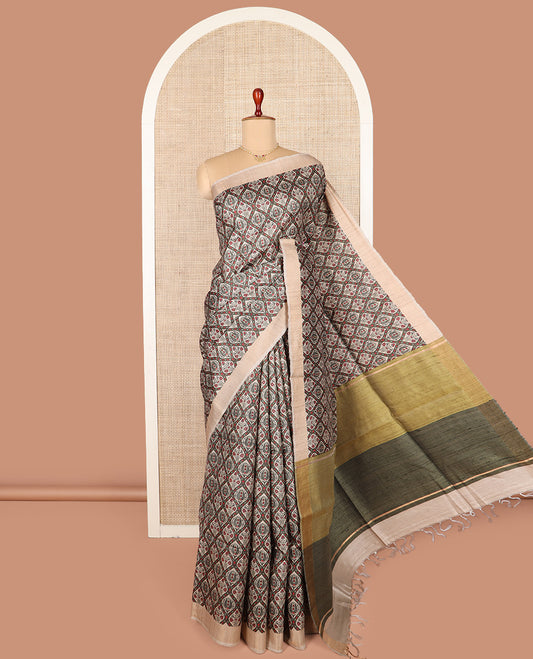 Green ogee patterned tussar silk saree, contrast bavanji border, and double-color plain pallu