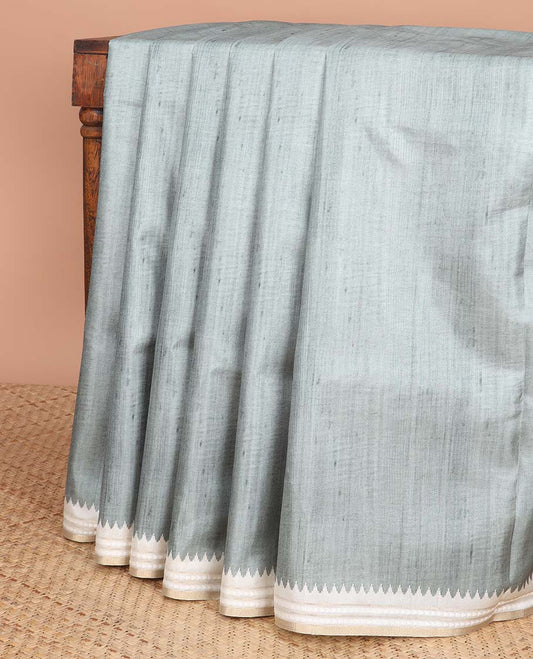 Green semi-banaras tussar saree with contrast striped border & egypt theme pallu