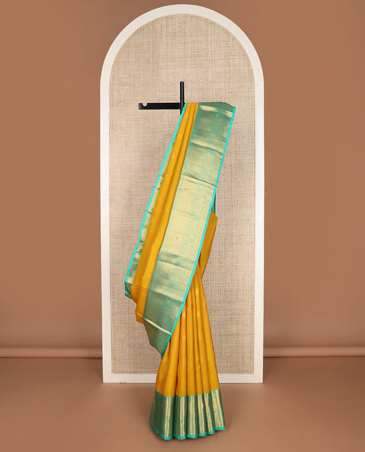Yellow zari buttas vasundhara silkmix saree,contrast intricate pallu & border of poun,banaras,paayadi kann,mayil & yaali