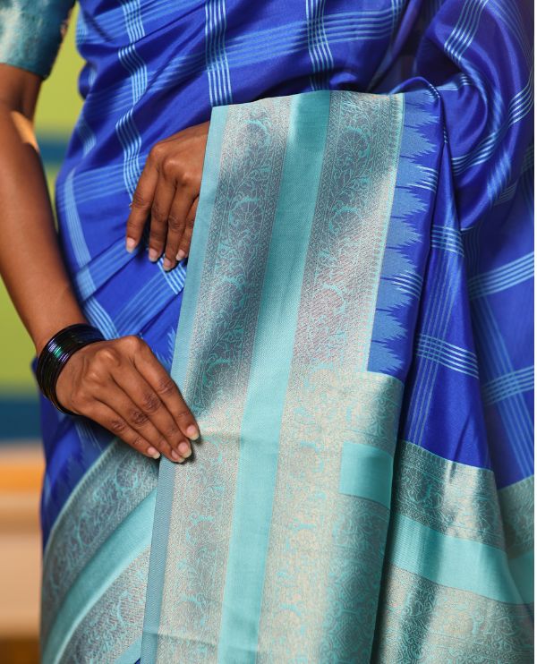 Blue Art Kanchi Silk Saree Features Butta Enclosed Checks, a Contrast Temple Rettai Pettu Border, Grand Pallu, and a Contrast Blouse