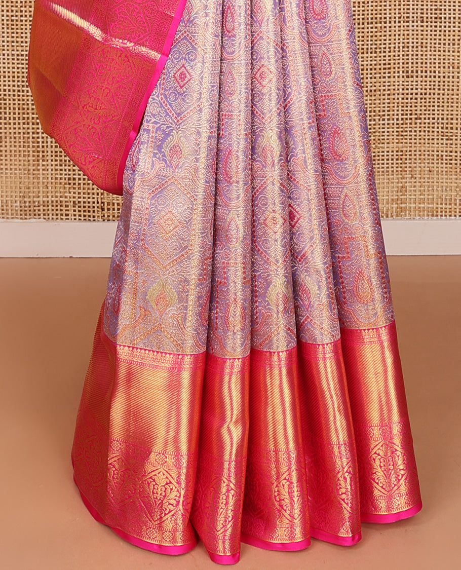 Gleaming lavender zari jacquard Kanchipuram tissue silk saree, contrast border of thilakam, kathir, muthu, kaddu kamalam, and Mughal-style floral bouquets, and jaal pallu