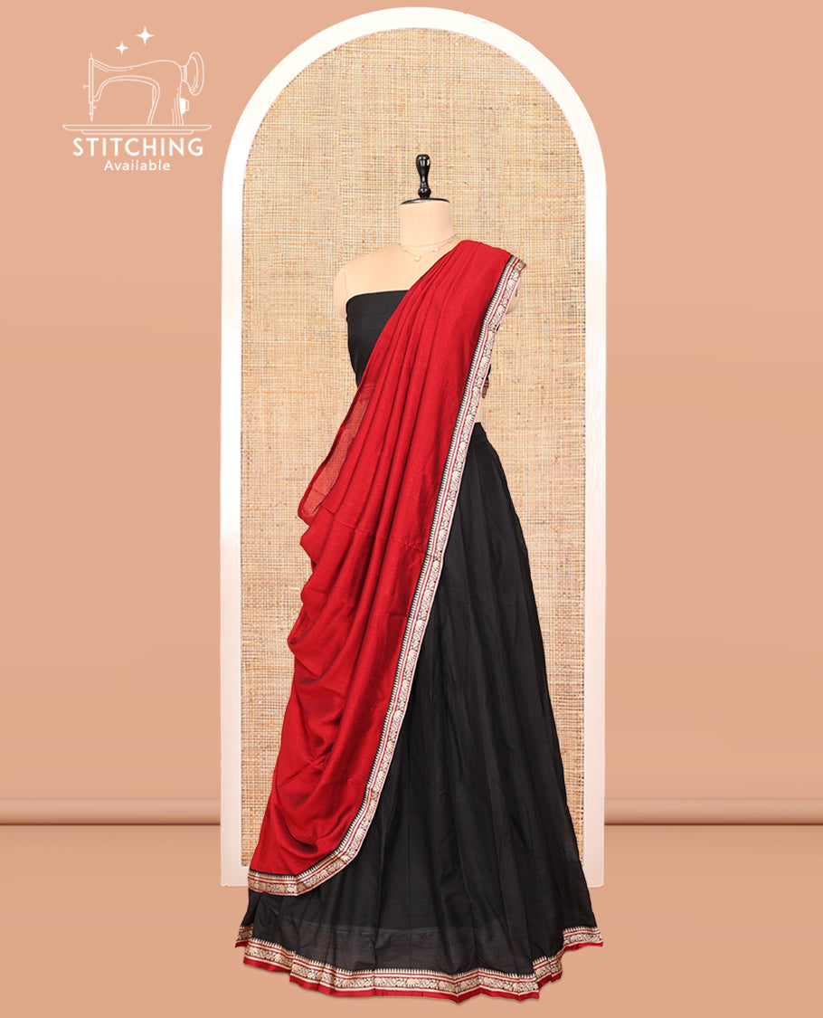 Black Cotton Half-Saree Features Plain Skirt, a Contrast Traditional Border, a Matching Blouse, and a Contrast Dhavani