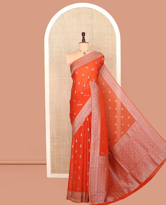 Orange Georgette Saree, Steeped with Buttas, Highlighted by a Traditional Floral Creeper Border, Intricately Designed Pallu, and  a Matching Blouse