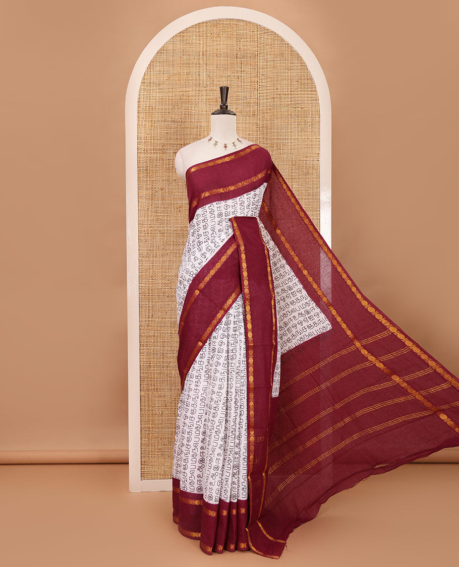 White-purple Tamil letters printed Sungudi cotton saree, contrast rudraksham rettai pettu zari border, striped pallu & contrast veldhari striped blouse