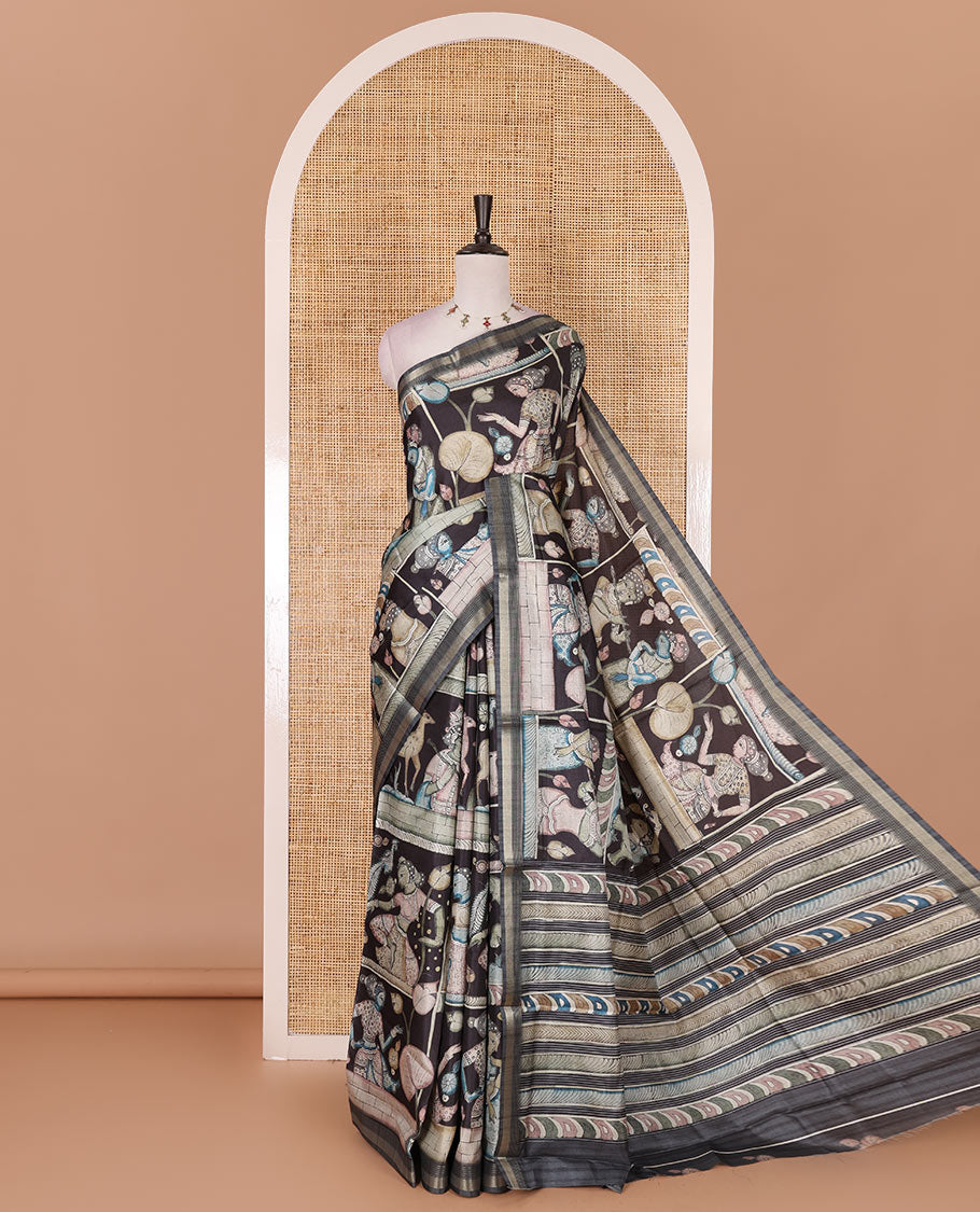 Black kalamkari ancient human figurines and animal motifs printed semi-tussar saree, gold zari piping border, printed pallu, and contrast printed blouse