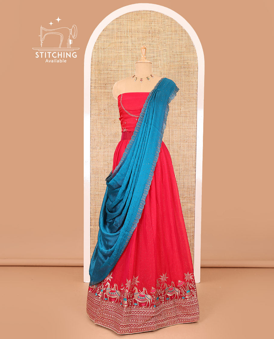 Red half-saree, Swarovski stone work with girl-on-the-horse motifs embroidered bordered satin georgette skirt, a matching satin georgette blouse, and a contrast Swarovski stone work scallop dhavani