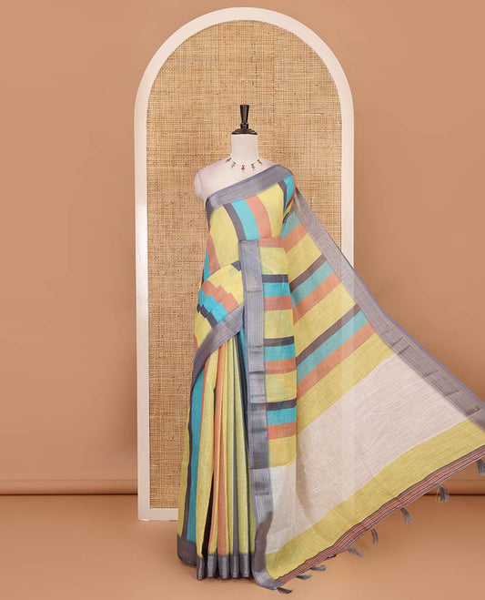 Multi-colored stripes-block linen  saree, zari bavanji border, plain pallu & printed blouse