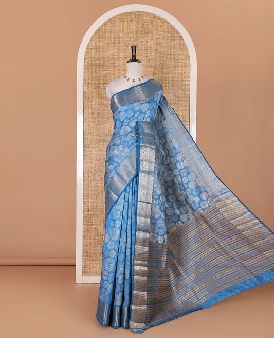 Blue uniquely printed semi-tussar saree, traditional zari border, zari striped pallu, and a matching blouse